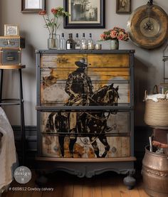 an old dresser is decorated with art and antiques