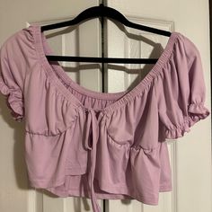 Pink Short Sleeve Shirt. Never Worn. Size Medium. Trendy Purple Tops For Brunch, Purple Short Sleeve Top For Brunch, Purple Cropped Top For Spring, Fitted Purple Top For Brunch, Purple Cropped Tops For Day Out, Cropped Purple Tops For Day Out, Purple Stretch Casual Blouse, Purple Summer Tops For Brunch, Casual Stretch Purple Blouse