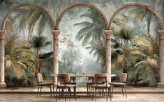 a dining room with palm trees and arches