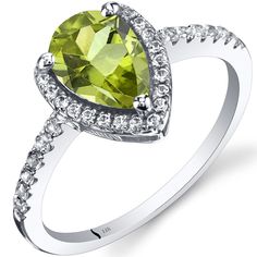 This 1.54 carats Natural Peridot ring features a beautiful pear shape gemstone, complemented by Natural White Topaz accents, set in hypoallergenic 14k White Gold.Main Stone Gemstone: Natural Peridot Size: 9 x 6 mm Carat weight: 1.54 carats Shape: pear shape Accent StoneGemstone: Natural White TopazMetal information and Peridot Rings, Jewelry Questions, Peridot Engagement Rings, Shine Jewelry, White Topaz Rings, Ring Ideas, Expensive Jewelry, Peridot Ring, Peridot Gemstone