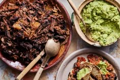 three plates filled with different types of food next to bowls of guacamole