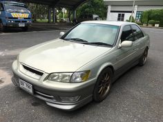 a silver car parked in front of a building