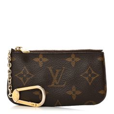 This is an authentic LOUIS VUITTON Monogram Key Pouch. This pouch is crafted of Louis Vuitton monogram coated canvas in brown. The top zipper opens to a brown crossgrain leather interior with an attached brass clasp that can be clipped to your keys or handbag. Classic Monogram Canvas Pouch For Everyday Use, Luxury Monogram Canvas Wallets For Everyday Use, Luxury Monogram Canvas Pouch For Everyday Use, Travel Pouch In Brown Monogram Canvas, Brown Monogram Canvas Pouch For Travel, Brown Monogram Canvas Travel Pouch, Travel Brown Monogram Canvas Pouch, Luxury Brown Pouch With Zipper Closure, Luxury Brown Bag With Zipper Pouch