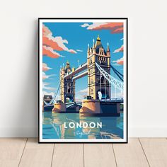 an art print of the tower bridge in london, england on a white wall with wood flooring