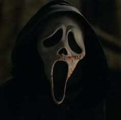 a person wearing a mask with their mouth open