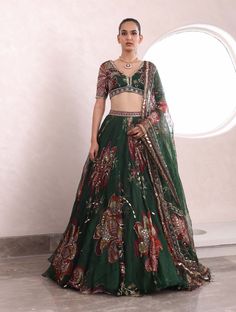 Indulge in the timeless allure of exquisitely crafted lia lehenga, featuring a resplendent embroidered blouse that effortlessly complements the opulence of a heavily embroidered lehenga and dupatta. Note: This product will be exclusively handcrafted for you, making the colour/texture/pattern slightly vary from the image shown, due to multiple artisan-led techniques and processes involved. Luxury Long Skirt Choli With Dupatta, Luxury Floral Embroidery Maxi Length Lehenga, Luxury Green Choli With Dupatta, Luxury Green Raw Silk Lehenga, Luxury Cotton Silk Lehenga With Intricate Embroidery, Luxury Brocade Choli With Motifs, Luxury Fitted Choli With Resham Embroidery, Luxury Art Silk Choli For Festive Season, Luxury Brocade Lehenga With Cutdana