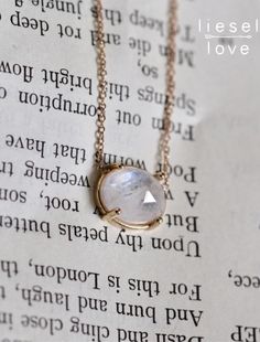 "Rainbow moonstone is known to provide psychic protection, acting as a prism by diffusing energy through the aura. Give our \"Prism\" necklace as a token of protection to your loved ones or even to yourself! Also makes a stunning addition to a wedding outfit! - Rose cut Rainbow Moonstone measures 8 x 10mm - Moonstone gives off hints of blue and purple in the light - Natural inclusions give a different texture to each stone, making each necklace one of a kind! - Choose your length: 14\" - 15\" - Oval Moon Phase Necklace As A Gift, Oval Moon Phase Necklace For Gift, Oval Moon Phase Necklace Gift, Moon Phase Oval Necklace For Gifts, Round Moonstone Gemstone Crystal Necklaces, Mystical Oval Gemstone Necklace, Spiritual Oval Moonstone Necklace, Moonstone Gemstone Oval Necklace, Oval Moonstone Gemstone Necklace