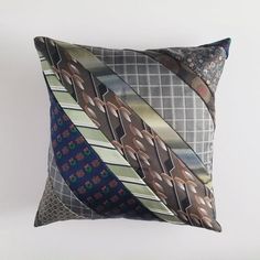 a decorative pillow with ties on it