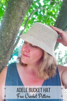 a woman wearing a crochet hat with the text, adelle bucket hat free crochet pattern