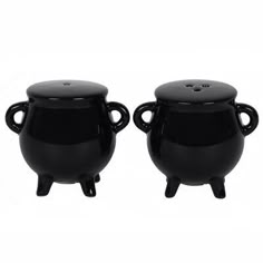 two black pots with handles on each side