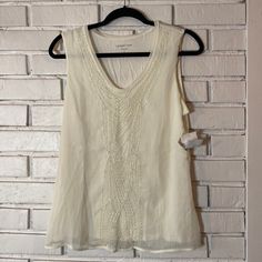 Coldwater Creek Chiffon Beaded Sleeveless Top Size Small 8 Nwt Ivory With Beaded Neckline And Center Lined With Jersey Underlay Elegant Tank Top For The Beach, Elegant Tank Top For Beach, Elegant Summer Beach Vest, Elegant Sleeveless Tank Top For Beach, Spring Embellished V-neck Tank Top, Elegant Sleeveless Tank Top For Vacation, Spring Beaded Fitted Tank Top, Embellished V-neck Tank Top For Summer, Chic Embellished Tank Top For Summer