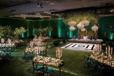 an elaborately decorated ballroom with chandeliers and tables set up for a formal function