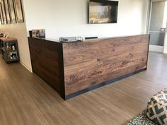 the reception desk is made out of wood