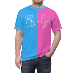 Celebrate the excitement of revealing your baby's gender with our Pink and Blue Half and Half Tee. This gender reveal shirt is the perfect addition to your baby shower, setting the stage for a memorable gender reveal party. With its unique split design, this tee is the ultimate keeper of the gender secret until the big reveal. Whether you're on team girl or team boy, this gender reveal gift is a fun and stylish way to announce the newest addition to your family. Make your gender reveal unforgett Casual Blue Shirt For Gender Reveal, Blue Short Sleeve Tops For Gender Reveal, Blue Crew Neck Top For Gender Reveal, Pink Crew Neck Shirt For Gender Reveal, Short Sleeve Shirt For Gender Reveal With Graphic Print, Short Sleeve Shirt With Graphic Print For Gender Reveal, Pink Cotton Shirt For Gender Reveal, Blue Unisex Shirt With Letter Print, Cotton Short Sleeve Shirt For Gender Reveal