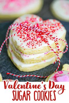 valentine's day sugar cookies with red and white sprinkles on top