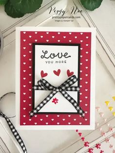 a card with hearts on it and the words love you more