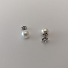 These stud-style earrings, crafted from 14K white gold, are of exceptional quality and elegance.The pearls used are cultured saltwater Akoya pearls, responsibly sourced from Japan.The round shape of the pearls combined with their excellent luster gives them a stunning appearance. They showcase a white color with visible orient, adding to their allure.The pearls' surface is very clean, free from visible inclusions, enhancing their overall beauty.Each piece of our jewelry is unique and individuall Stud Style, Earring Crafts, Akoya Pearls, Pearl Stud Earrings, Style Earrings, Pearl Studs, Round Shape, White Color, White Gold