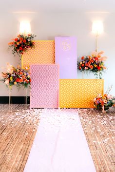 the aisle is decorated with colorful flowers and paper cutouts on it's sides