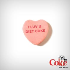 a heart shaped candy with the words i luv u diet coke on it