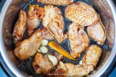 the chicken is cooking in the pot on the stove top, ready to be cooked