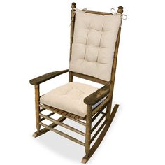 a wooden rocking chair with a cushion on it's back and seat padding