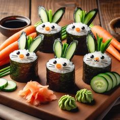 sushi with cucumbers, carrots and other vegetables on a cutting board