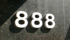 three white numbers are placed next to each other