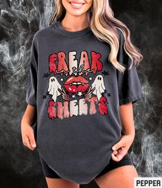 You're gonna love this super cute Freak In The Sheets retro Halloween T Shirt. Show off your spooky season aesthetic in this soft and trendy tshirt! Find more Fall shirts and cute accessories at Starrie Apparel. 👻 🎃 ✩ 𝗔𝗱𝘂𝗹𝘁 𝗕𝗲𝗹𝗹𝗮 𝗖𝗮𝗻𝘃𝗮𝘀 𝗧𝗲𝗲: https://starrieapparel.etsy.com/listing/1417894766 ✩ 𝗔𝗱𝘂𝗹𝘁 𝗖𝗼𝗺𝗳𝗼𝗿𝘁 𝗖𝗼𝗹𝗼𝗿𝘀 𝗧𝗲𝗲: ✩ 𝗔𝗱𝘂𝗹𝘁 𝗚𝗶𝗹𝗱𝗮𝗻 𝗦𝘄𝗲𝗮𝘁𝘀𝗵𝗶𝗿𝘁: Comfort Colors Halloween Shirt, Freak In The Sheets Funny Halloween Tshirt Cute Ghost Retro Graphic Tee Cute Spooky Womens Plus Size T-shirt SIZE UP for an OVERSIZED FIT (see size chart in listing photos). ✩ Our shop uses direct-to-garment printing to make our products. The design ink is sprayed on, then allowed to soak into the fibers of the garment. This process yields fine quality pr Trendy Halloween Graphic T-shirt, Halloween Graphic Print Crew Neck Top, Retro Halloween Short Sleeve Tops, Grunge Halloween Fan Merchandise Tops, Grunge Halloween Graphic Print Tops, Grunge Halloween Tops With Graphic Print, Vintage Crew Neck Halloween Tops, Grunge Graphic Print Tops For Halloween, Vintage Crew Neck Tops For Halloween