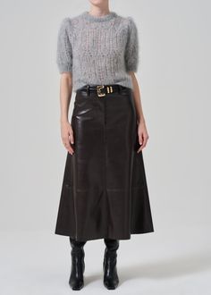 Crafted from panels of supple recycled leather that are incredibly smooth in texture, this high rise skirt pairs perfectly with a cozy sweater and knee boots.  This fit is true to size. Looks Like: Luxurious dark chocolate brown leatherFeels Like: Buttery supple recycled leather with some stretch From our HUMANITY Collection Chocolate Leather Skirt Outfit, Christian Dior Skirt, Dark Brown Leather Skirt Outfit, Flared Skirt Outfit, Long Suede Skirt, Brown Leather Skirt Outfit, Brown Leather Skirt, Brown Pencil Skirt, New Closet