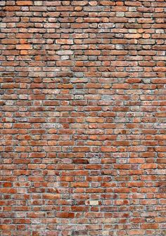 an old brick wall is shown in red