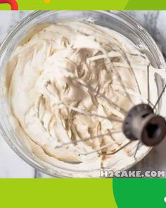 an overhead view of a cake batter in a glass bowl