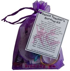 a purple bag filled with lots of different items next to a sign that says dance teacher's survival kit