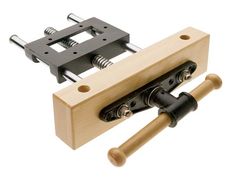 a pair of clamps are attached to a piece of wood with two screws