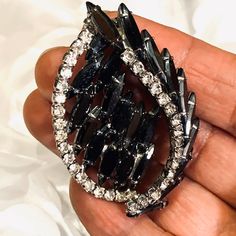 Vintage Black Glass And Rhinestone Silver Tone Brooch is absolutely a stunning Brooch there are no missing rhinestones none of the black glass is cracked or broken it measures 2 1/2 inches width and 1 1/2 inches length can be worn either way Black Brooch Jewelry For Wedding, Black Brooch Jewelry For Party, Glamorous Crystal Brooches For Evening, Black Party Jewelry Brooch, Glamorous Evening Crystal Brooches, Black Rhinestones Brooch For Gift, Vintage Black Brooch For Anniversary, Antique Black Wedding Brooch, Vintage Black Collectible Brooches