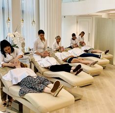 a group of people getting their feet massages