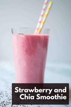 strawberry and chia smoothie in a tall glass with two straws sticking out of it