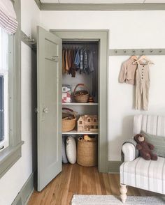 an open closet in the corner of a room