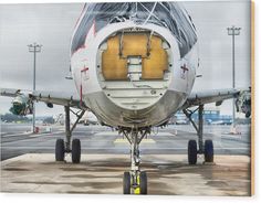 an airplane parked on the tarmac at an airport