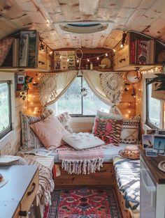 the interior of a small camper with lots of lights and decor on the walls