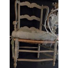 an old chair with a wicker seat and back