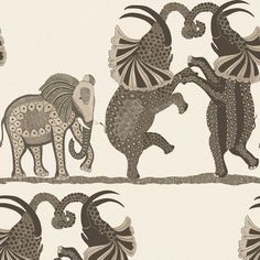 an elephant and giraffes are depicted in this fabric designed to look like african art