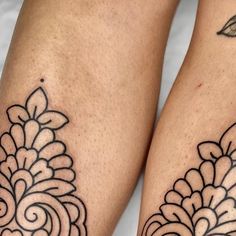 two black and white tattoos on both legs