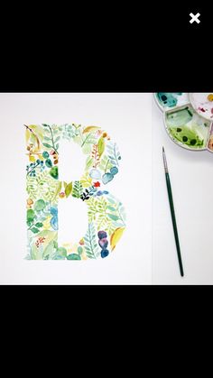 the letter b is painted with watercolors on paper