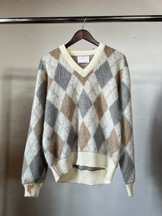 "1970s Mohair pullover sweater. Has staining on cuff of one arm, otherwise in good vintage condition.  Measurements flat: 23\" Pit to Pit  25\" Length All sales final, if you have any questions, please ask them before you buy! Thank you!" Retro Long Sleeve Argyle Sweater, Vintage Argyle Sweater For Fall, Vintage Wool Sweater For Fall, Vintage V-neck Sweater For Fall, Vintage Wool Crew Neck Top, Vintage Wool Tops For Winter, Retro Argyle Pattern Crew Neck Sweater, Retro Crew Neck Sweater With Argyle Pattern, Retro Crew Neck Argyle Sweater