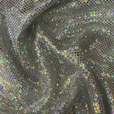 Step into a world of creativity with the mesmerizing Broken Glass Hologram fabric from Spandex Palace. This lightweight and stretchy Polyester spandex blend is more than just a fabric - it's a gateway to endless possibilities. Whether you're crafting activewear, dancewear, swimwear, or cosplay costumes, this fabric will elevate your creations to the next level. The standout feature of this fabric is its stunning holographic effect, adding a touch of sparkle and magic to any design you can imagin Space Party, Shattered Glass, Broken Glass, Arm Sleeve, Yoga Wear, Costume Design, Endless Possibilities, Spandex Fabric, Dance Wear