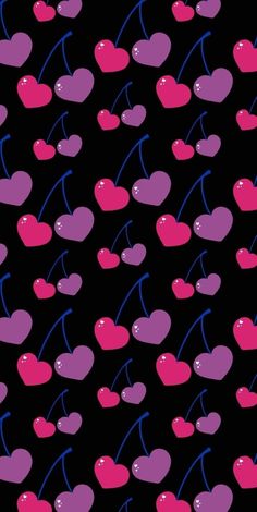 a black background with pink and purple cherries