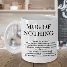 a coffee mug with the words mug of nothing written on it sitting on a table