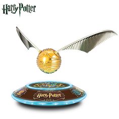 a harry potter flying saucer with a golden egg on it's back and wings