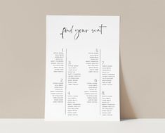 a table plan with the words find your seat written in cursive writing on it