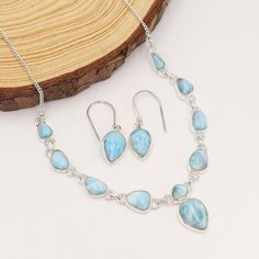 Larimar Necklaces, Sterling Silver Necklaces, Blue Genuine Larimar Silver Necklace, Statement Necklace Earring Set, Women's Necklaces This breathtaking Natural Blue Larimar and Sterling Silver Statement Necklace and Earring Set for Women is the perfect accessory to elevate your look to new heights! Crafted with exquisite care, the necklace features mesmerizing Larimar gemstones in a stunning shade of blue, showcasing their natural beauty. The intricate sterling silver details add a touch of eleg Blue Larimar Jewelry For Jewelry Making, Blue Larimar Dangle Jewelry, Blue Larimar Teardrop Jewelry, Blue Teardrop Larimar Jewelry, Larimar Necklaces, Necklaces Blue, Silver Statement Necklace, Larimar Necklace, Yellow Plates